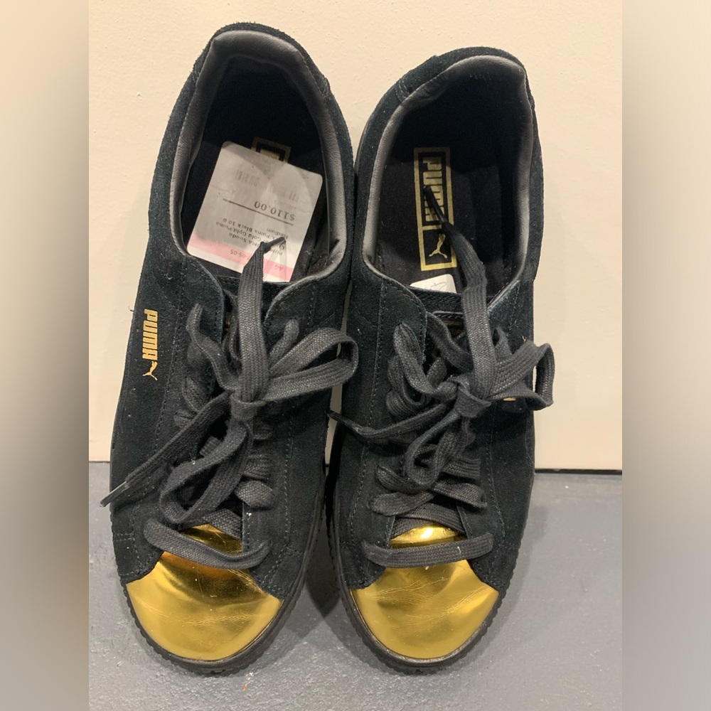 Puma Women size 10 B Suede Black and gold sneakers